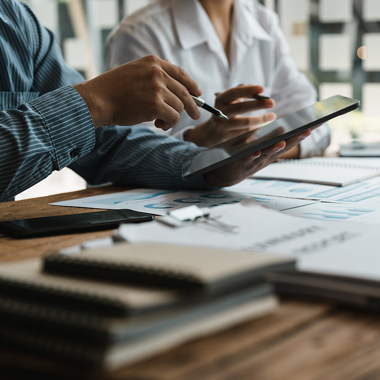 Business advisers meeting to analyze and discuss the situation on the financial report in the meeting room. Investment Consultant,Financial Consultant,Financial advisor and accounting concept.